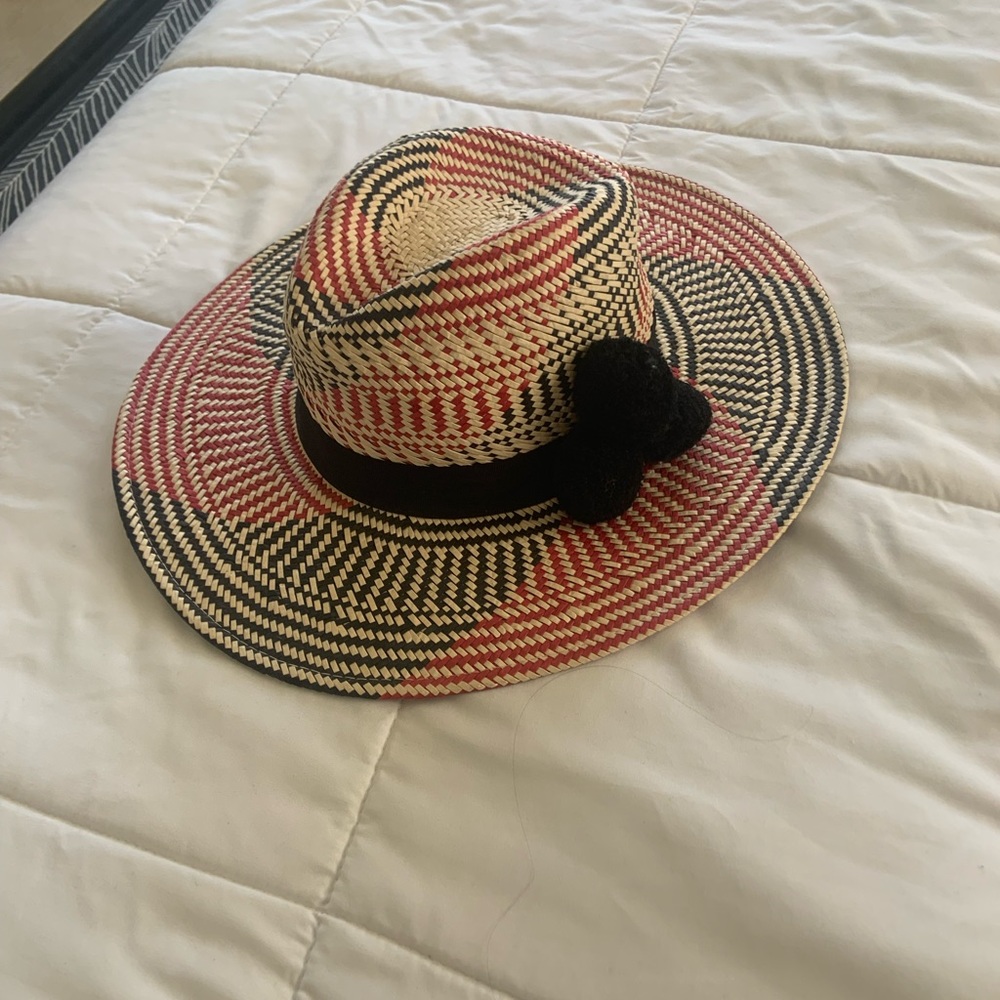 Womens red and black straw hat with pom pom band